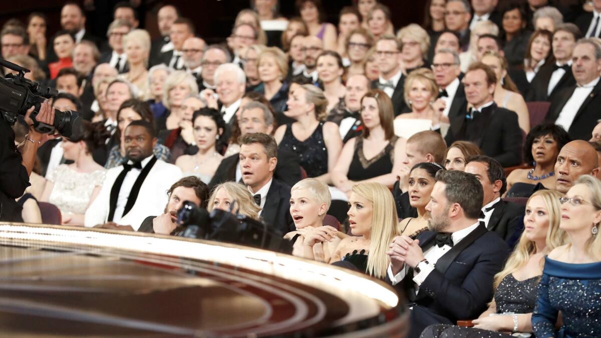 The audience at the Academy Awards is stunned after realizing that "La La Land" was mistakenly announced as best picture. The actual winner was "Moonlight." http://lat.ms/2m3Wtny
