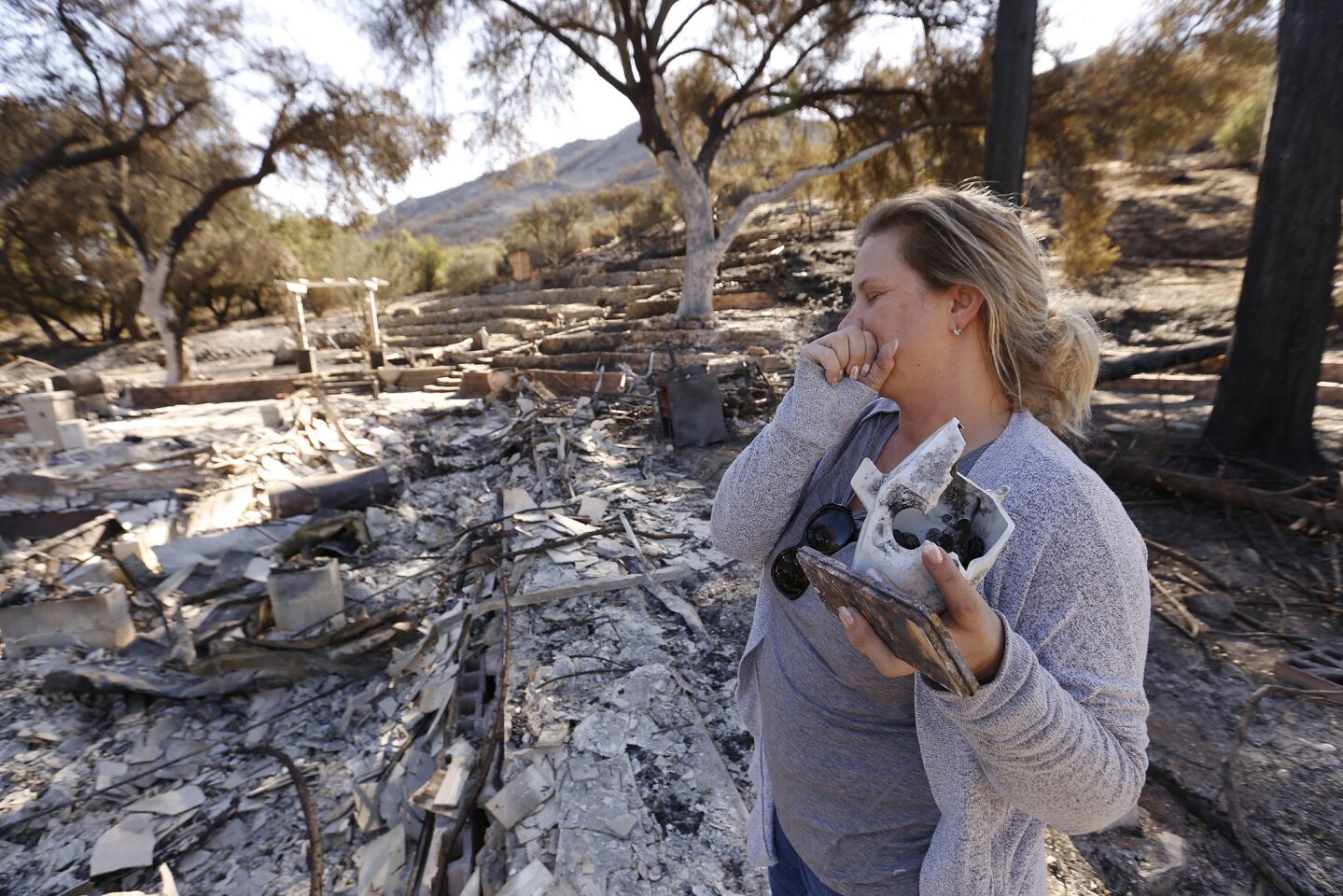 "We lost everything," said Rachel Bailey. Bailey and her partner, David Carr, were vacationing in Mexico. They flew back Monday and saw what was left of their street in Oak Forest Mobile Estates in Westlake Village.