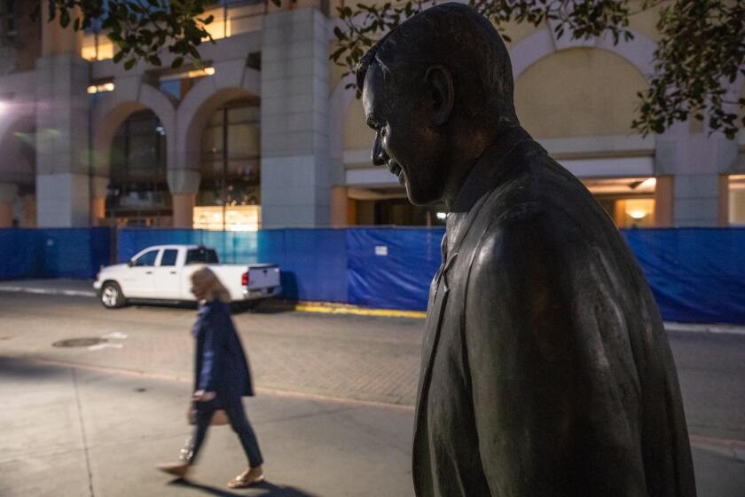 A statue of former Gov. Pete Wilson was recently placed back in its original spot at Horton Plaza after it was removed in October this year.