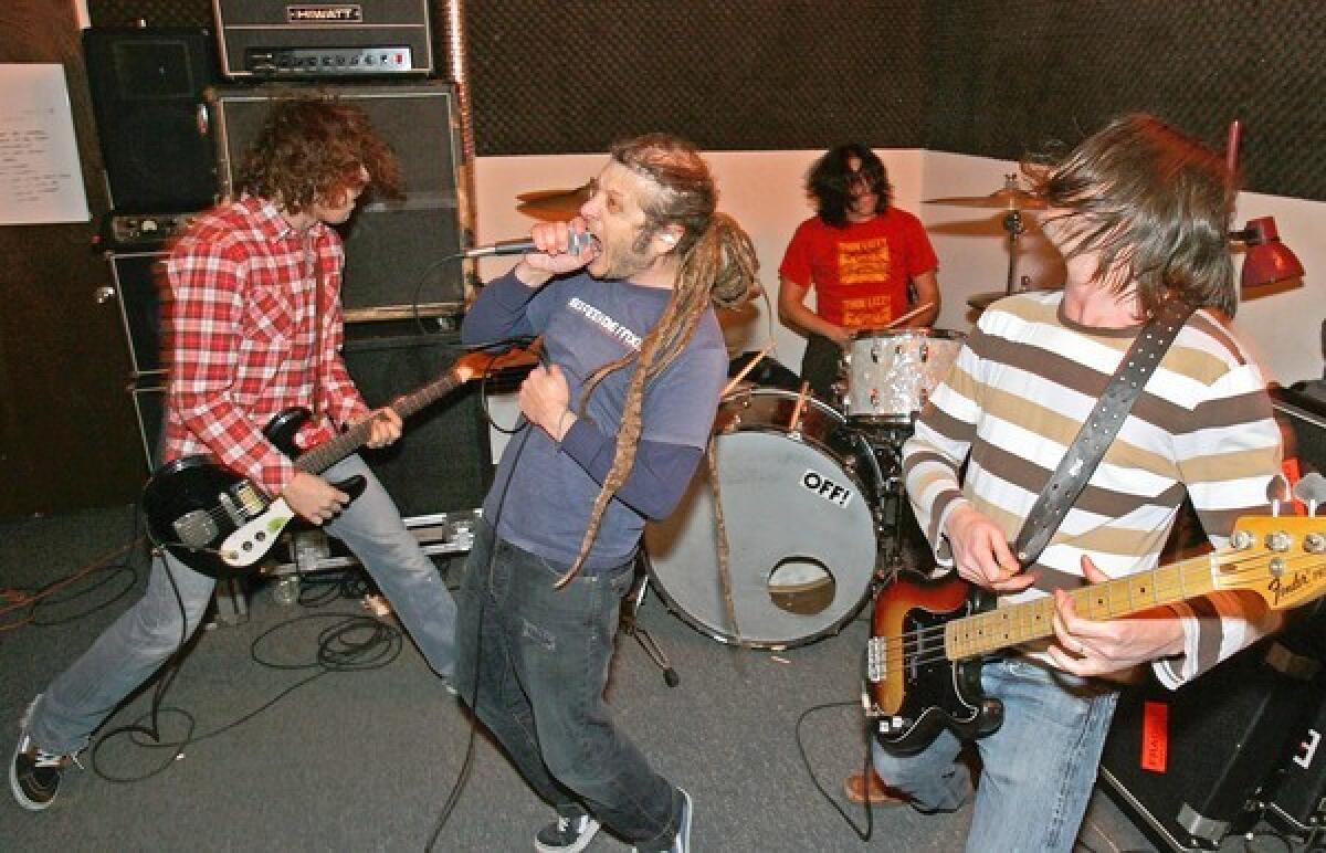 From left, Dmitri Coats, Keith Morris, Mario Rubacala and Steve MacDonald rehearse at ABC studio in Los Angeles.