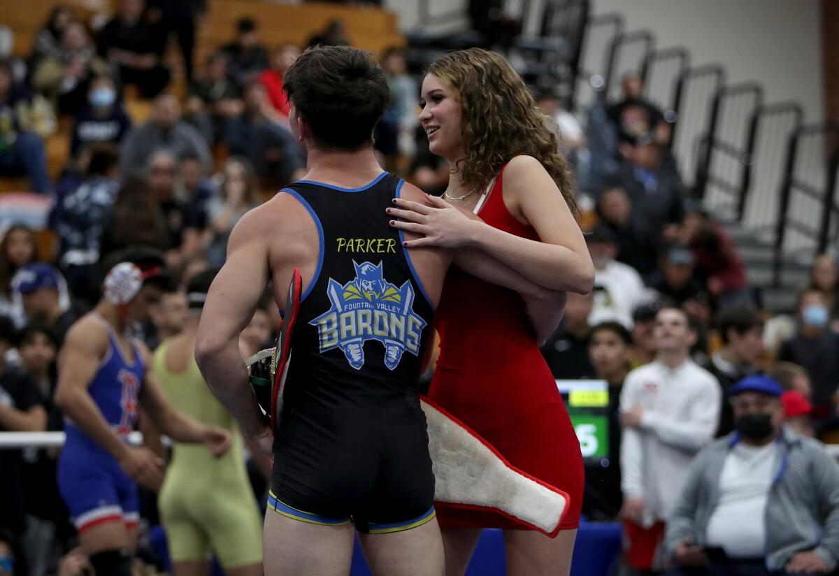 Fountain Valley's Zach Parker receives his championship belt from his girlfriend, Elena Racer.