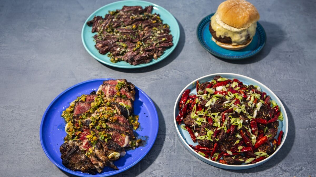 Clockwise from top left: grilled skirt steak with marjoram-lime salsa, dry-aged burger with garlic mayo, Sichuan chile hanger steak, and grilled rib-eye with pistachio gremolata.