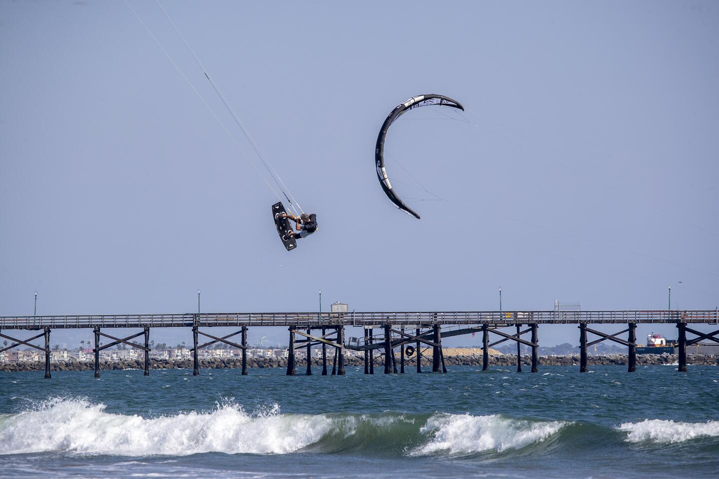 A kite surfer goes airborne in Seal Beach