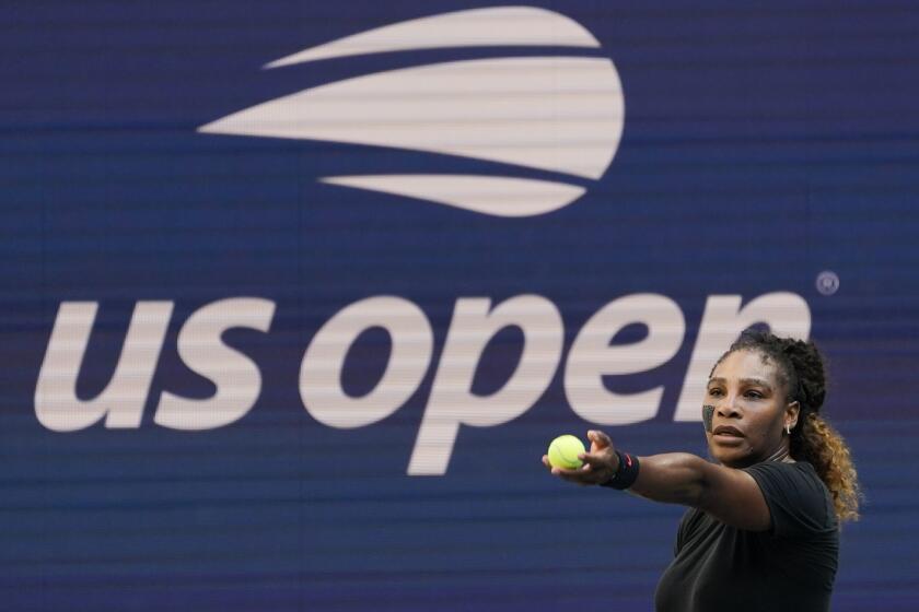 Serena Williams practices at Arthur Ashe Stadium before the start of the U.S. Open tennis tournament.