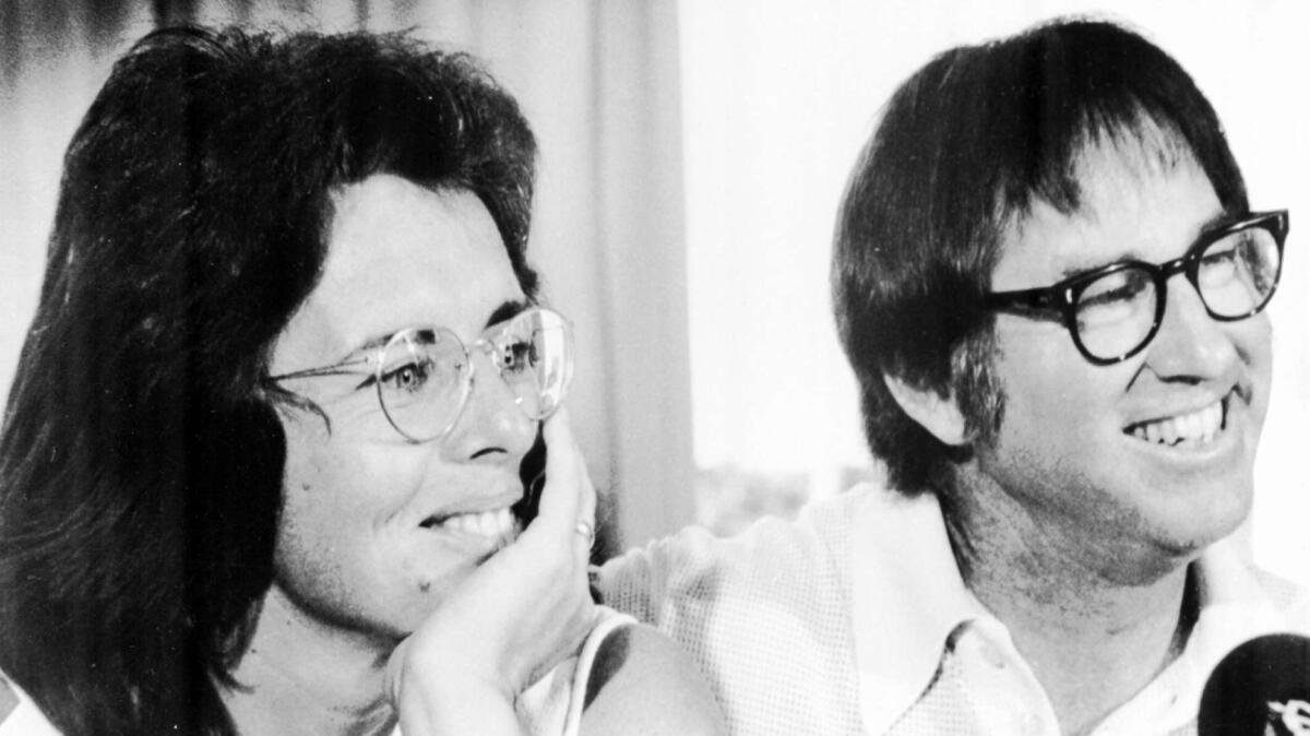 Billie Jean King and Bobby Riggs smile during a news conference in New York to publicize their upcoming match at the Houston Astrodome, in this July 11, 1973 photo. (AP Photo)