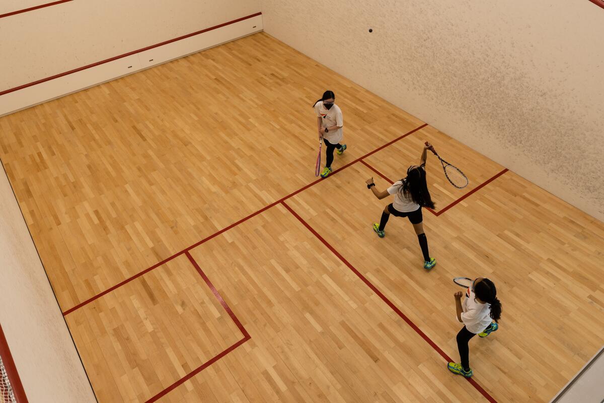 Students during squash practice at Access Youth Academy