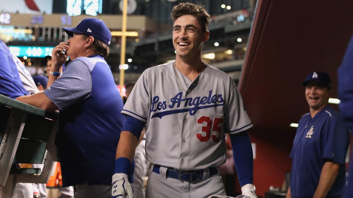 Dodgers first baseman Cody Bellinger reacts in the dugout after hitting a home run against the Arizona Diamondbacks on Aug. 9.