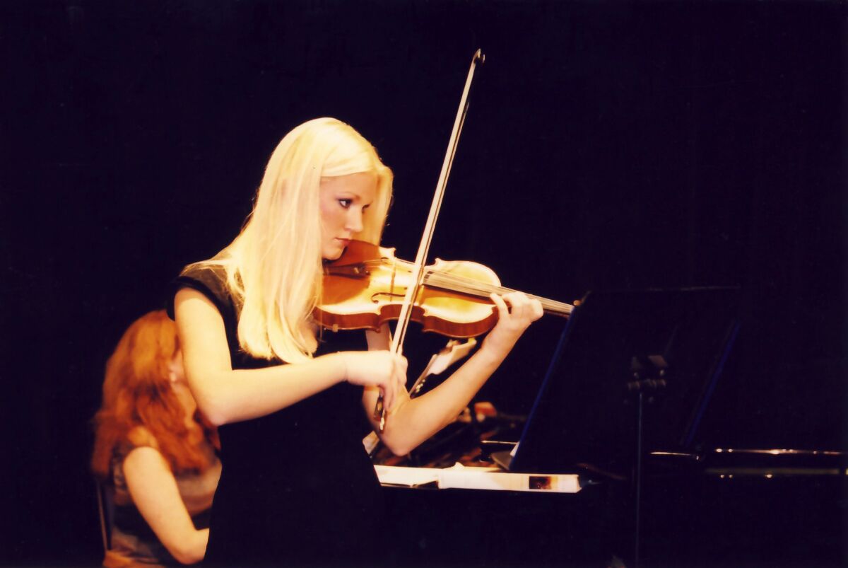 Kiersten Riedler plays violin at her senior recital at La Jolla Country Day School in May 2003.