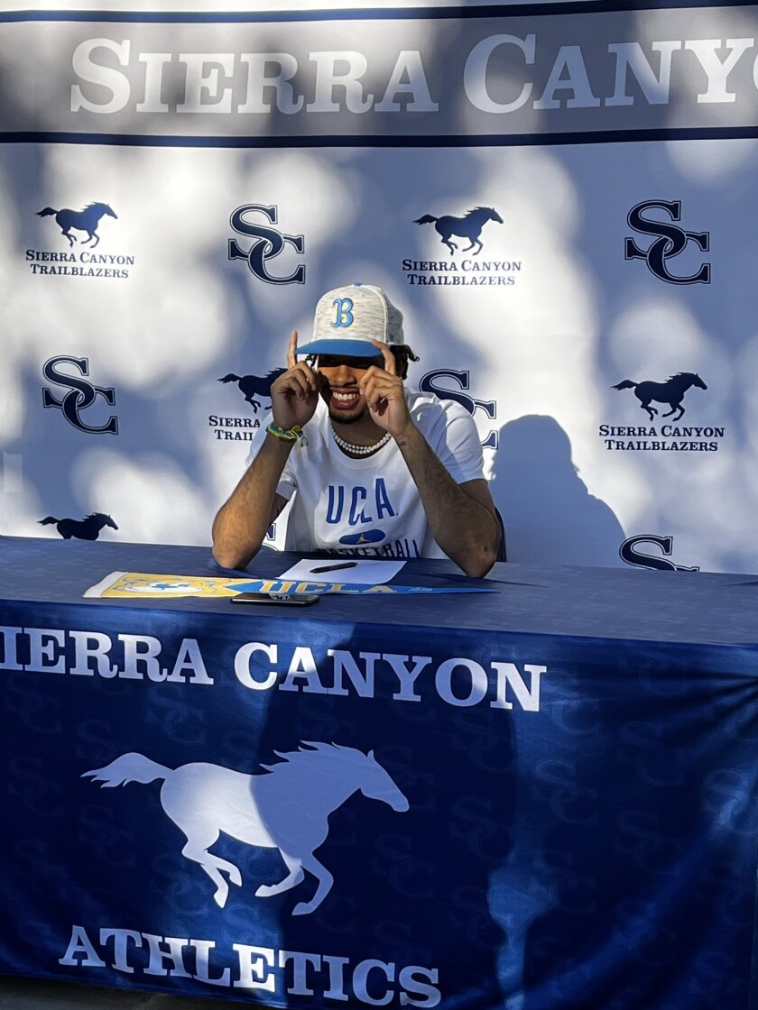 Sierra Canyon's Amari Bailey smiles after signing with UCLA during a ceremony at his high school Wednesday.