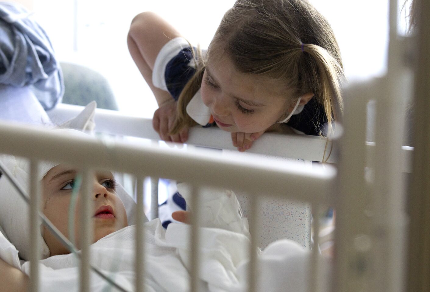 Daria Majkowski, 4, visits her brother Auguste, 3, at Children's Hospital Los Angeles.