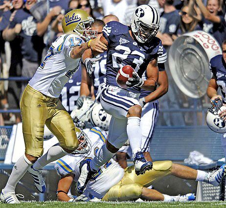 Brigham Young's David Tafuna races down the sideline with a blocked field-goal attempt during the second quarter Saturday before UCLA's Aaron Perez would make the tackle.