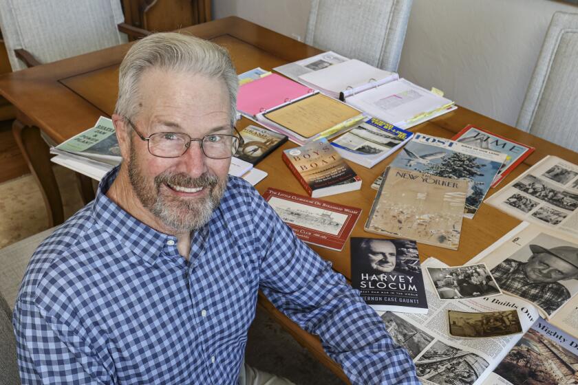 Solana Beach, CA - June 21: Author Casey Gaunt sits with information he uncovered in his research about San Diego native and dam builder Harvey Slocum at his home on Wednesday, June 21, 2023 in Solana Beach, CA. (Eduardo Contreras / The San Diego Union-Tribune)