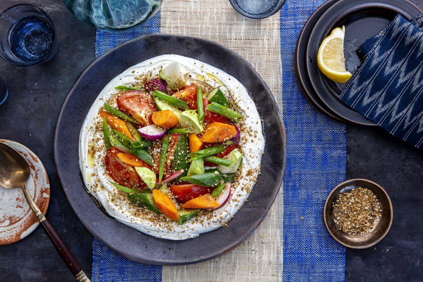 LOS ANGELES, CALIFORNIA, Dec. 1, 2020: Ben Mims' Rough-Chopped Salad with Yogurt and Dukkah from recipe by Adeena Sussman photographed for LA Times Food cooking section's Holiday Travel story, on Tuesday, Dec. 1, 2020, at the Proplink Studios in Arts District Los Angeles. (Silvia Razgova / For the Times, prop styling by Kate Parisian, food styling by Ben Mims) ATTN: 661373-la-fo-Holiday-Cooking