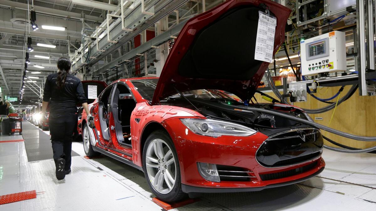 Several lawsuits filed recently claim workers faced discrimination at Tesla's factory in Fremont, Calif.