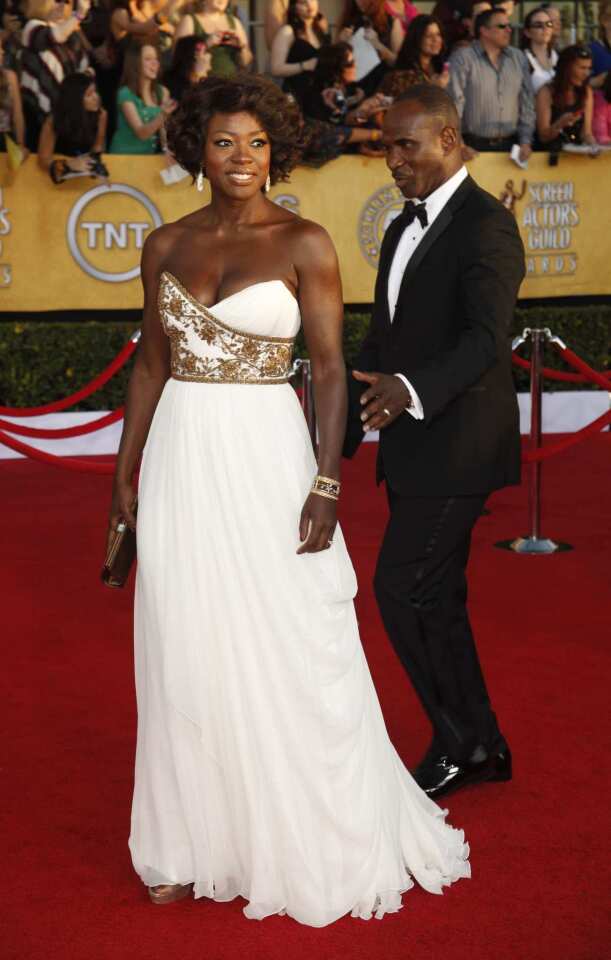 Viola Davis plays the goddess in a strapless cream Marchesa gown with gold embroidered bodice.