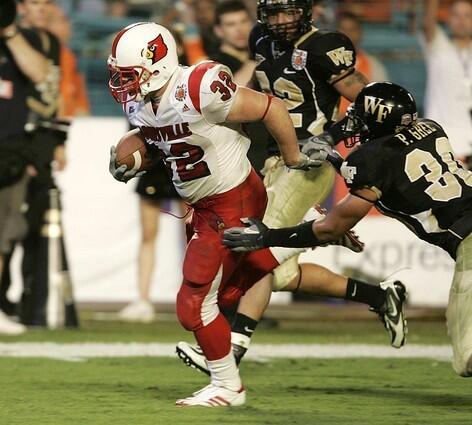 Louisville running back Brock Bolen breaks past Wake Forest defenders Patrick Ghee, right, and Josh Gattis on an 18-yard touchdown run.