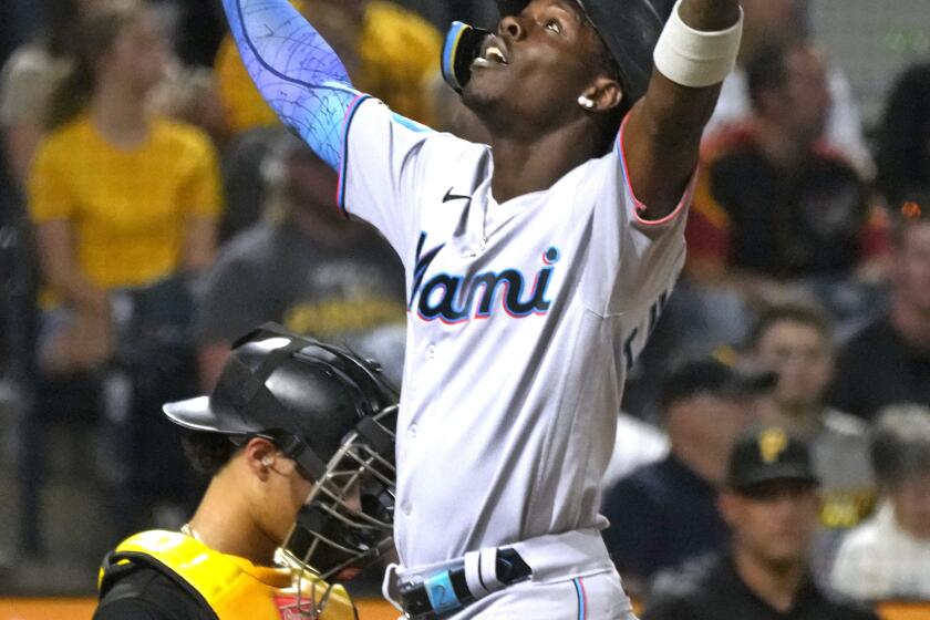 Miami Marlins' Jazz Chisholm Jr., right, celebrates as he returns to the dugout after hitting a solo home run off Pittsburgh Pirates starting pitcher Quinn Priester during the third inning of a baseball game in Pittsburgh, Saturday, Sept. 30, 2023. (AP Photo/Gene J. Puskar)