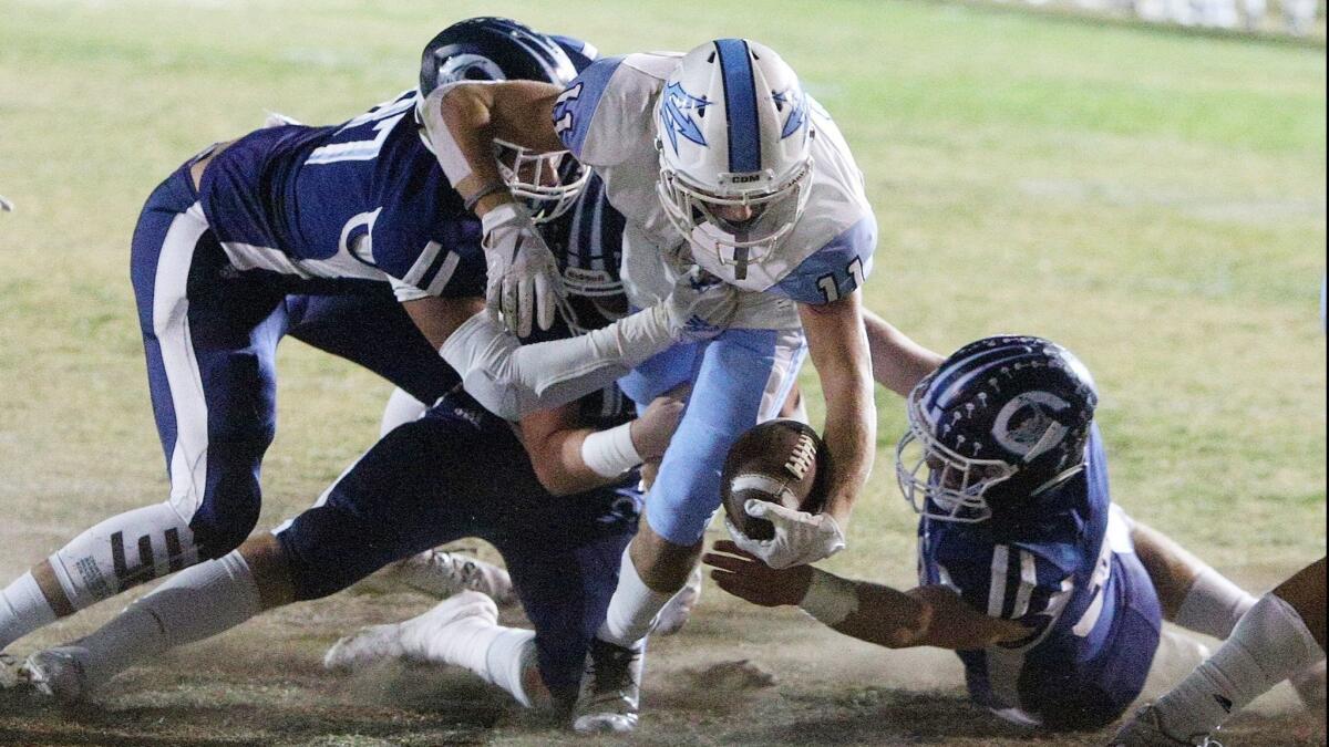 Bradley Schlom battles into the end zone for the first Corona del Mar High score in the semifinals of the CIF Southern Section Division 4 playoffs at Camarillo on Nov. 16.