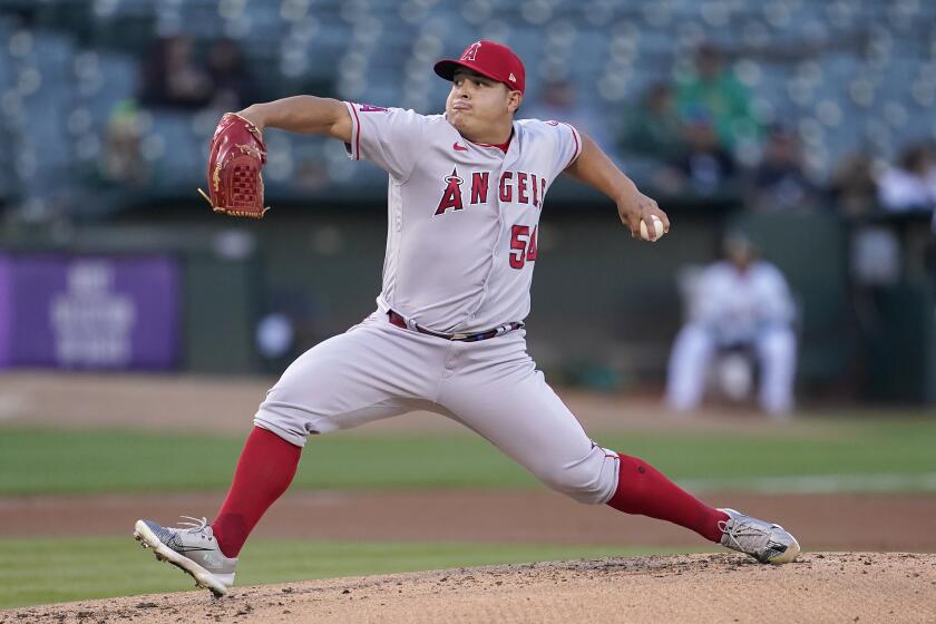 Los Angeles Angels' Jose Suarez pitches against the Oakland Athletics during the first inning of a baseball game in Oakland, Calif., Monday, Aug. 8, 2022. (AP Photo/Jeff Chiu)