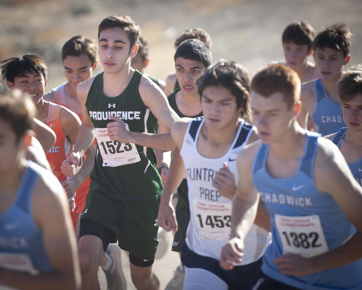 Providence's Chris Kelamyan (#1523) runs in the middle of the pack at the start of the boys varsity Prep League Cross Country finals at Pierce College Saturday. (Photo by Miguel Vasconcellos)