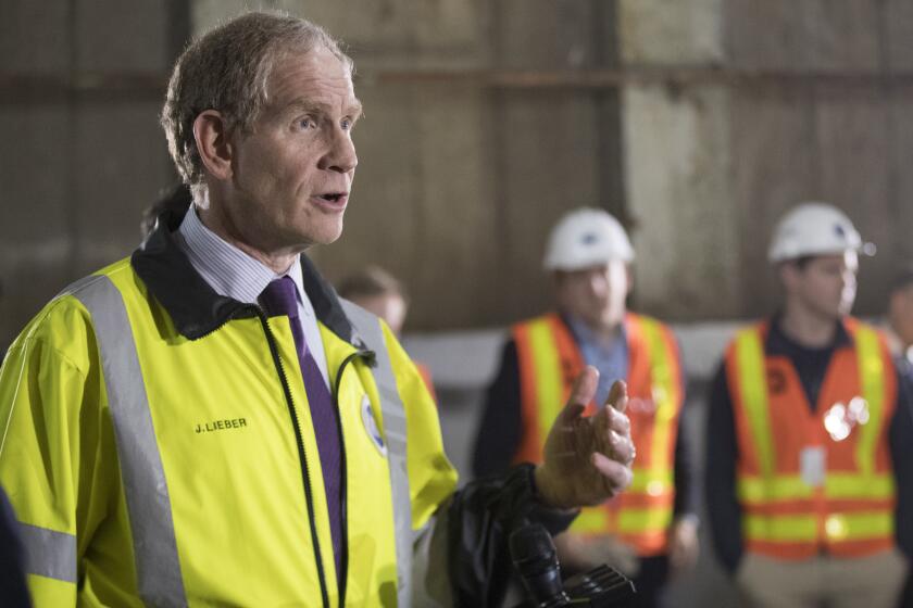 FILE - MTA Chief Development Officer Janno Lieber speaks during a news conference inside of a subway tunnel, May 3, 2019, in New York. New York's transportation authority will have to “shrink” its plans for maintaining and improving its subways, buses and commuter rails after the state’s governor abruptly halted a plan that would have funded the system by charging most motorists $15 to enter the core of Manhattan, the agency's head said Monday, June 10, 2024. (AP Photo/Mary Altaffer, File)