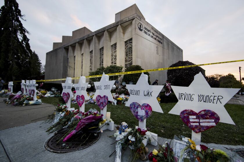File - A makeshift memorial stands outside the Tree of Life Synagogue in the aftermath of a deadly shooting in Pittsburgh, Oct. 29, 2018. Robert Bowers, the man about to face trial for shooting to death congregants in the Pittsburgh synagogue more than four years ago, has schizophrenia and structural and functional brain impairments, his lawyers said Monday, March 20, 2023, in a public court filing. (AP Photo/Matt Rourke, File)