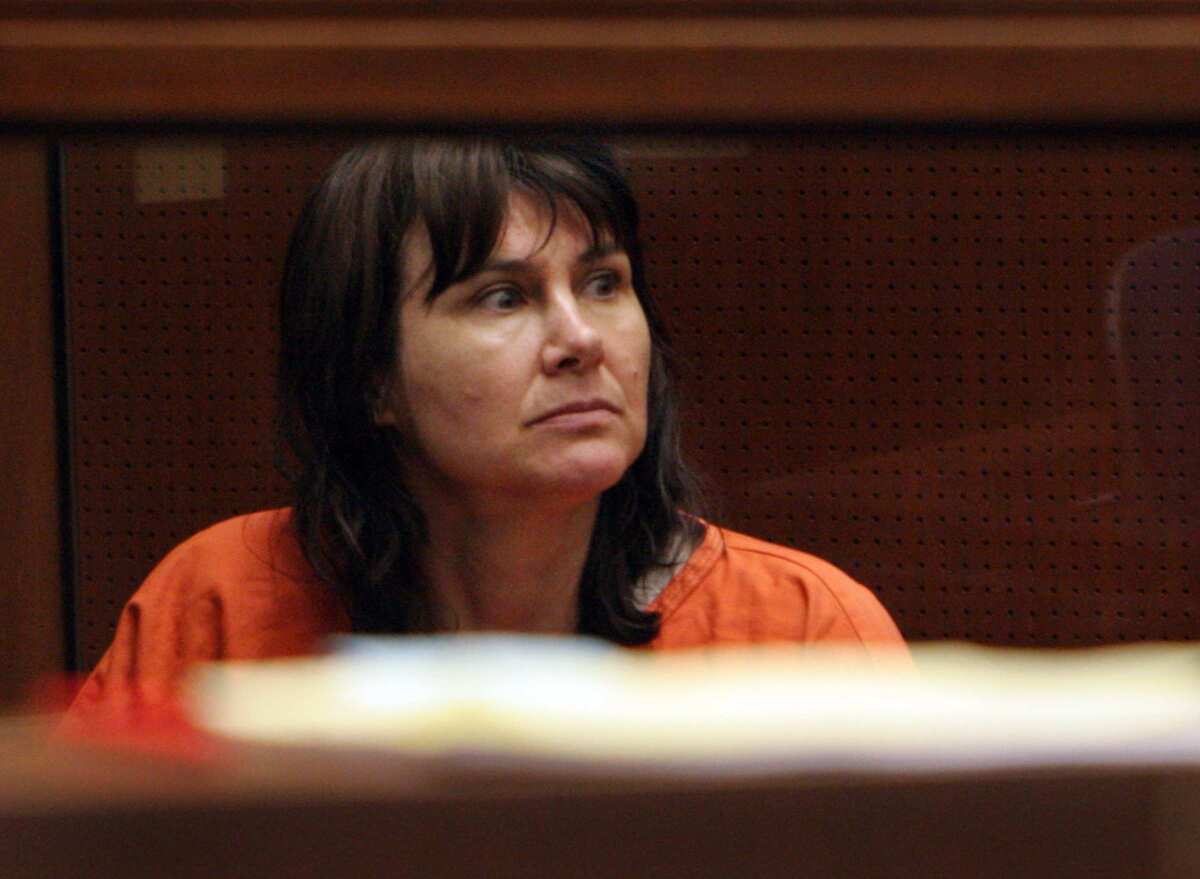 Stephanie Lazarus in court in 2009 in an orange top.