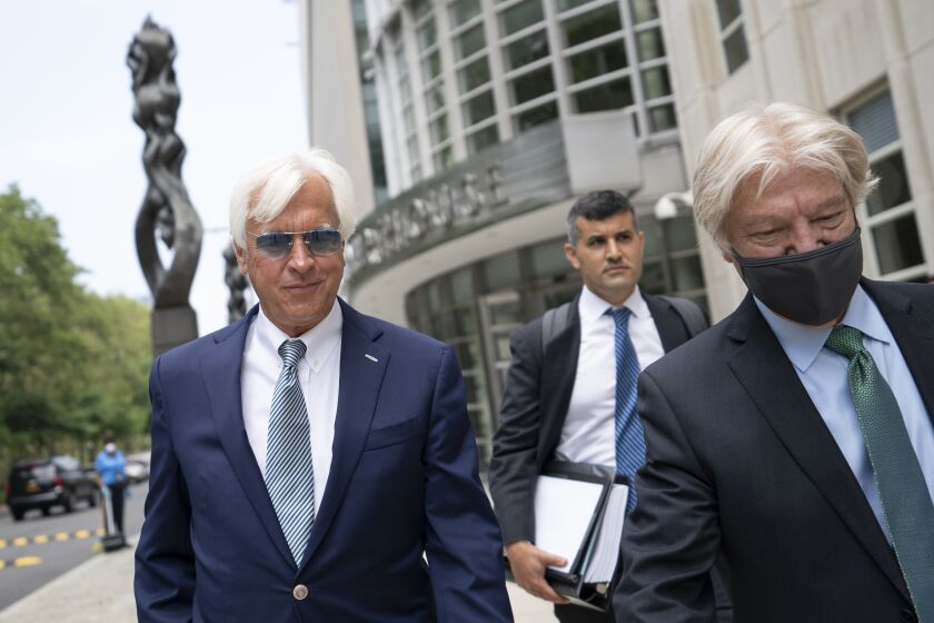 Horse trainer Bob Baffert leaves federal court, Monday, July 12, 2021, in the Brooklyn borough of New York. A New York federal judge seems sympathetic to Baffert's claims that his May suspension by the New York Racing Association was unconstitutional after Kentucky Derby winner Medina Spirit failed a postrace drug test. (AP Photo/John Minchillo)