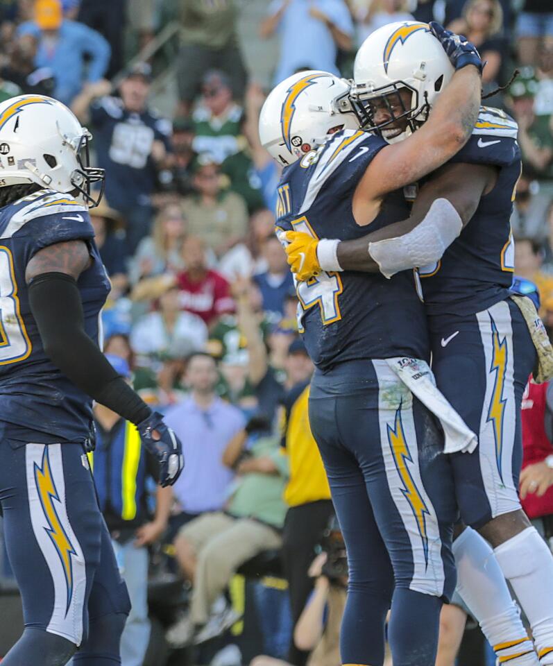 Chargers running back Melvin Gordon and fullback Derek Watt hug after a touchdown