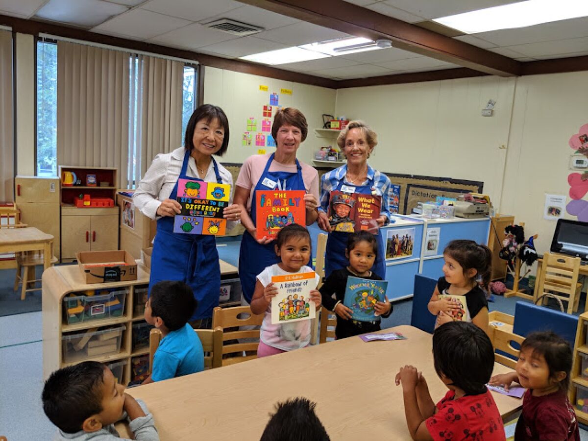 Assistance League of Rancho San Dieguito volunteers with children at Solana Beach Head Start.