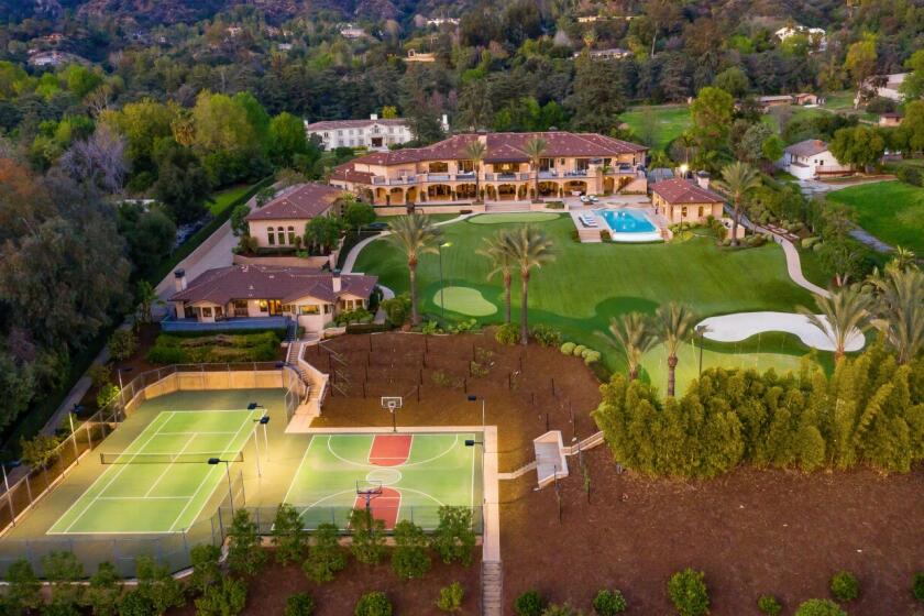 The four-acre estate includes a palatial mansion, guesthouse, swimming pool, tennis court, basketball court and two-hole golf course.