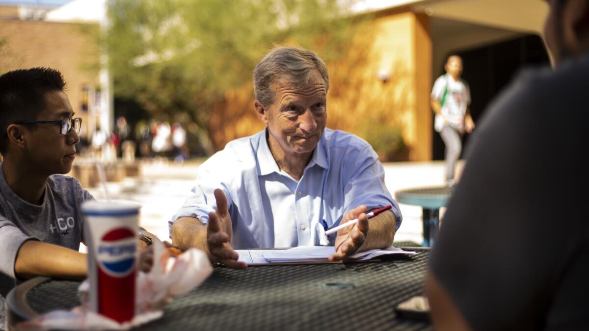Tom Steyer chats with students about registering to vote at Cal State Fullerton on Oct. 10. On Friday, the prominent anti-Trump activist received another suspicious package.