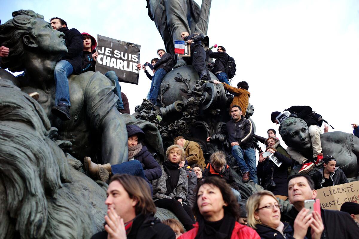 People gather at Place de la Nation during a rally in Paris on Jan. 11 to show unity and defiance in the face of terrorism.