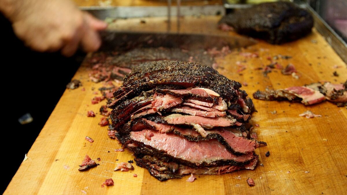 Pastrami is sliced to make some of Langer's signature #19 sandwiches in 2012.