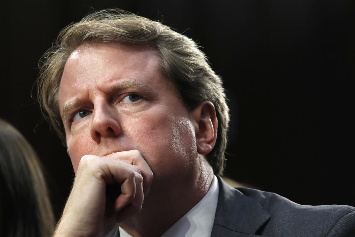 Don McGahn listens during a confirmation hearing for Supreme Court nominee Brett Kavanaugh