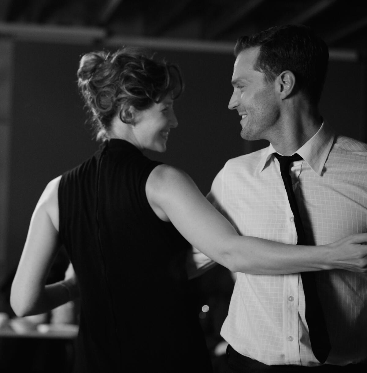 Caitriona Balfe and Jamie Dornan dance in the movie "Belfast."