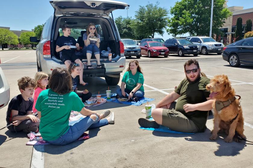 Colleyville principal Dana Judd had a parking lot picnic with friends Thursday before restaurants were allowed to resume patio service.