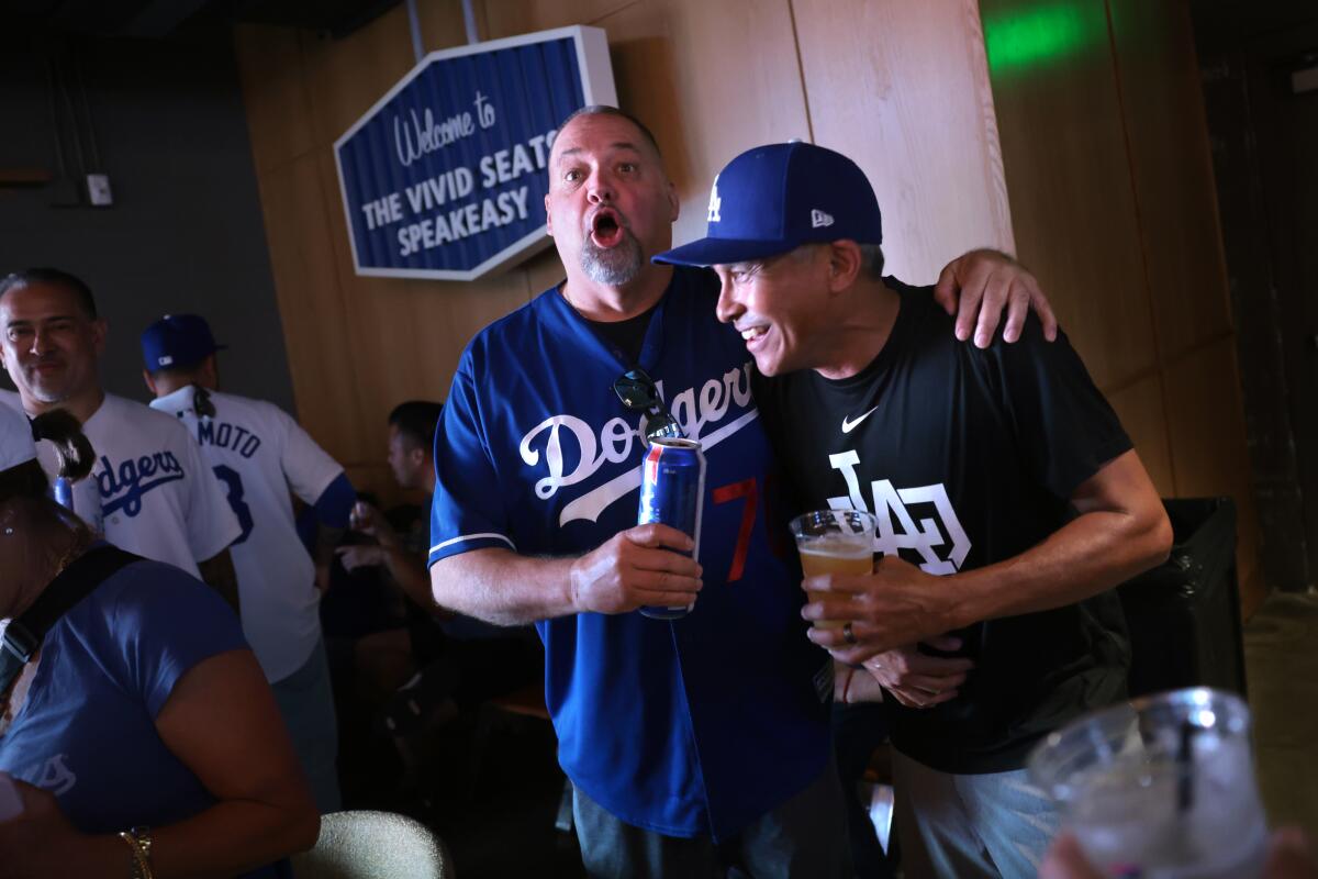 Fans enjoy themselves at the speakeasy under the Right Field Pavilion at Dodger Stadium.