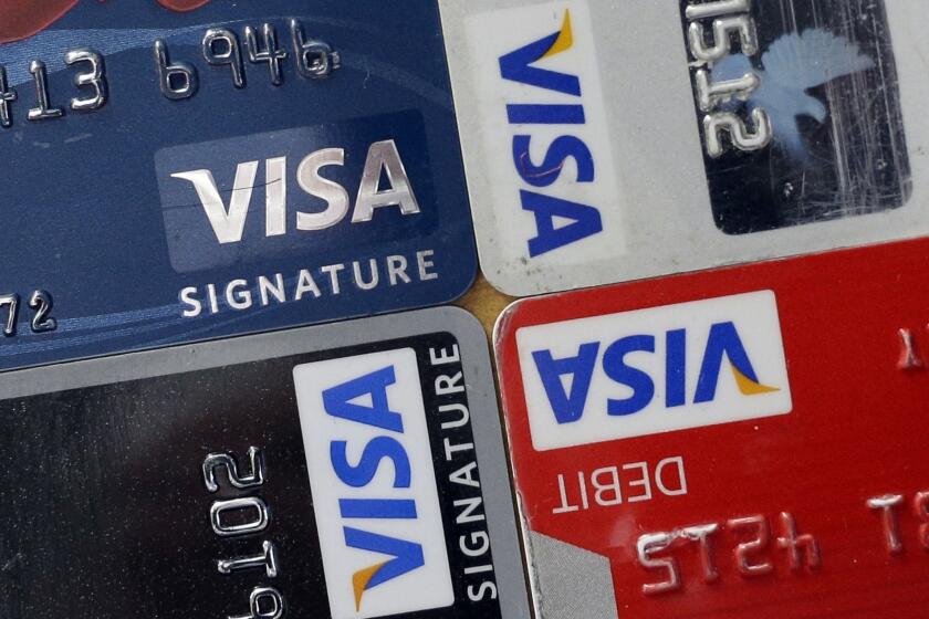 TransUnion reported that the average credit-card debt owed by consumers fell in the third quarter from a year earlier.