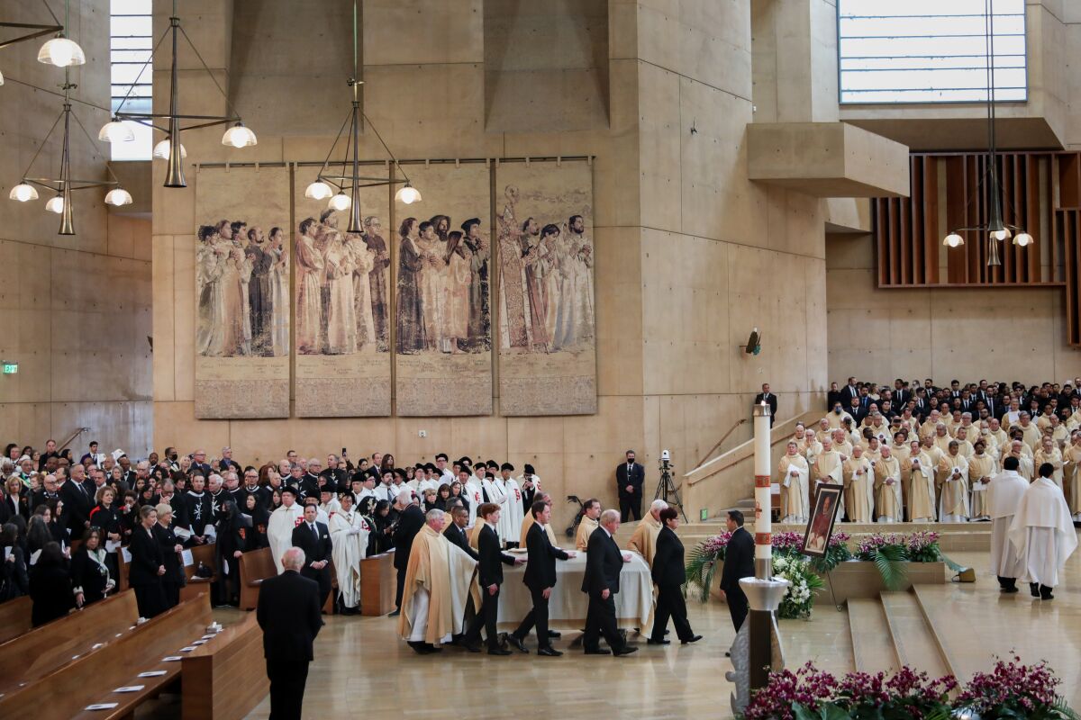 The bishop's casket   arrives at Cathedral of Our Lady of the Angels