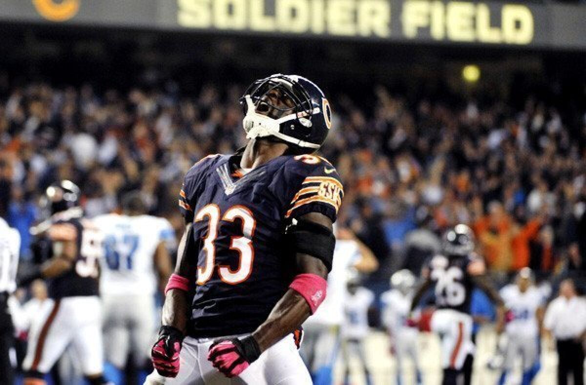 Bears cornerback Charles Tillman celebrates after recovering a fumble against the Lions last month in Chicago.