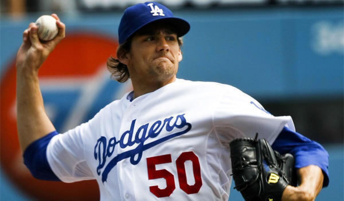 Pitcher Nathan Eovaldi was traded by the Dodgers to the Miami Marlins in a deal for infielder Hanley Ramirez.