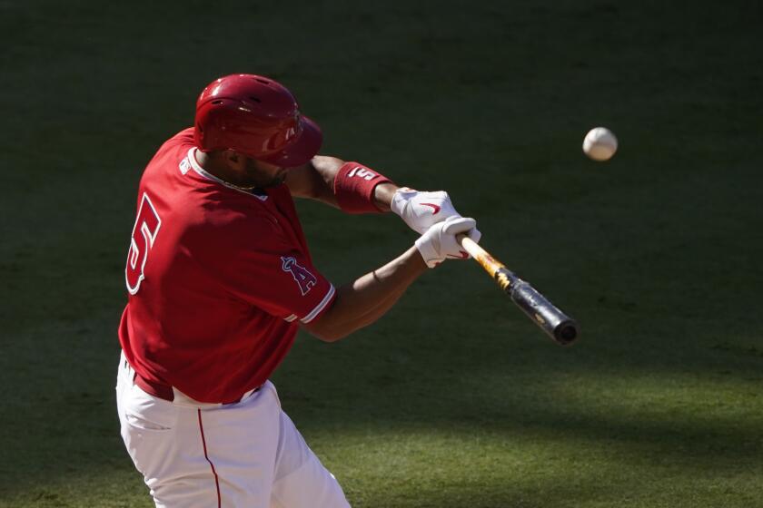 Los Angeles Angels first baseman Albert Pujols bats during an intrasquad game at baseball practice at Angel Stadium on Friday, July 10, 2020, in Anaheim, Calif. (AP Photo/Ashley Landis)