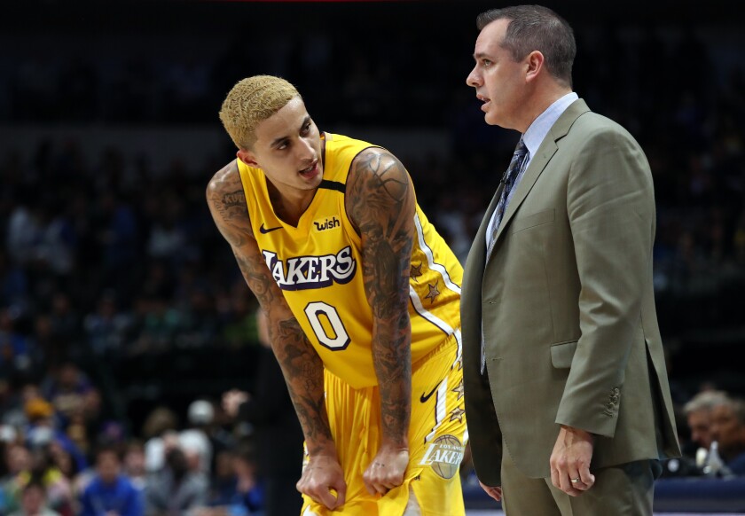 Lakers forward Kyle Kuzma talks with coach Frank Vogel during a game against the Mavericks on Jan. 10 at American Airlines Center.