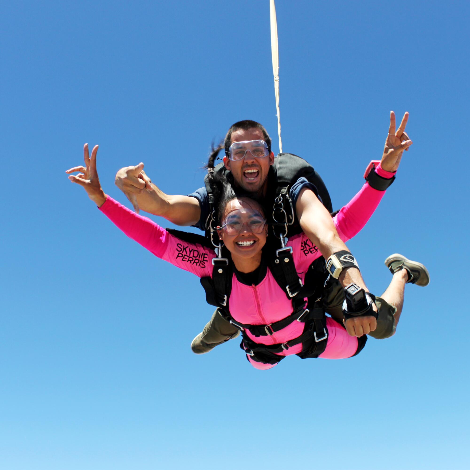 Two people skydiving.