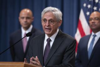 Attorney General Merrick Garland, flanked by Matt Graves, U.S. attorney for the District of Columbia, left, and Ronald Davis, director of the United States Marshals Service, holds a news conference as the Justice Department announced criminal charges against Iranian operatives suspected of hacking Donald Trump's presidential campaign and disseminating stolen information to media organizations, at the Justice Department in Washington, Friday, Sept. 27, 2024. (AP Photo/J. Scott Applewhite)