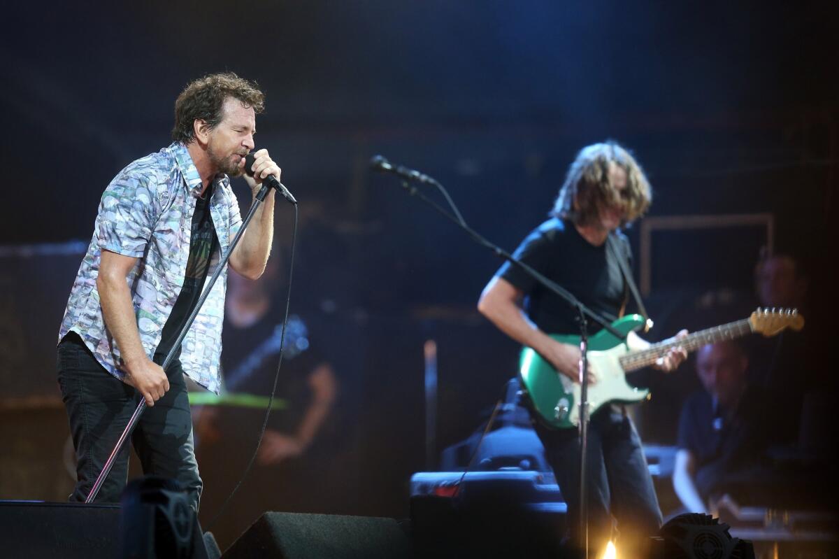 Eddie Vedder, left, and Pearl Jam perform on Jan. 17 in Auckland, New Zealand. A former executive for the band's management company was sentenced to jail on Friday for embezzling nearly $400,000.