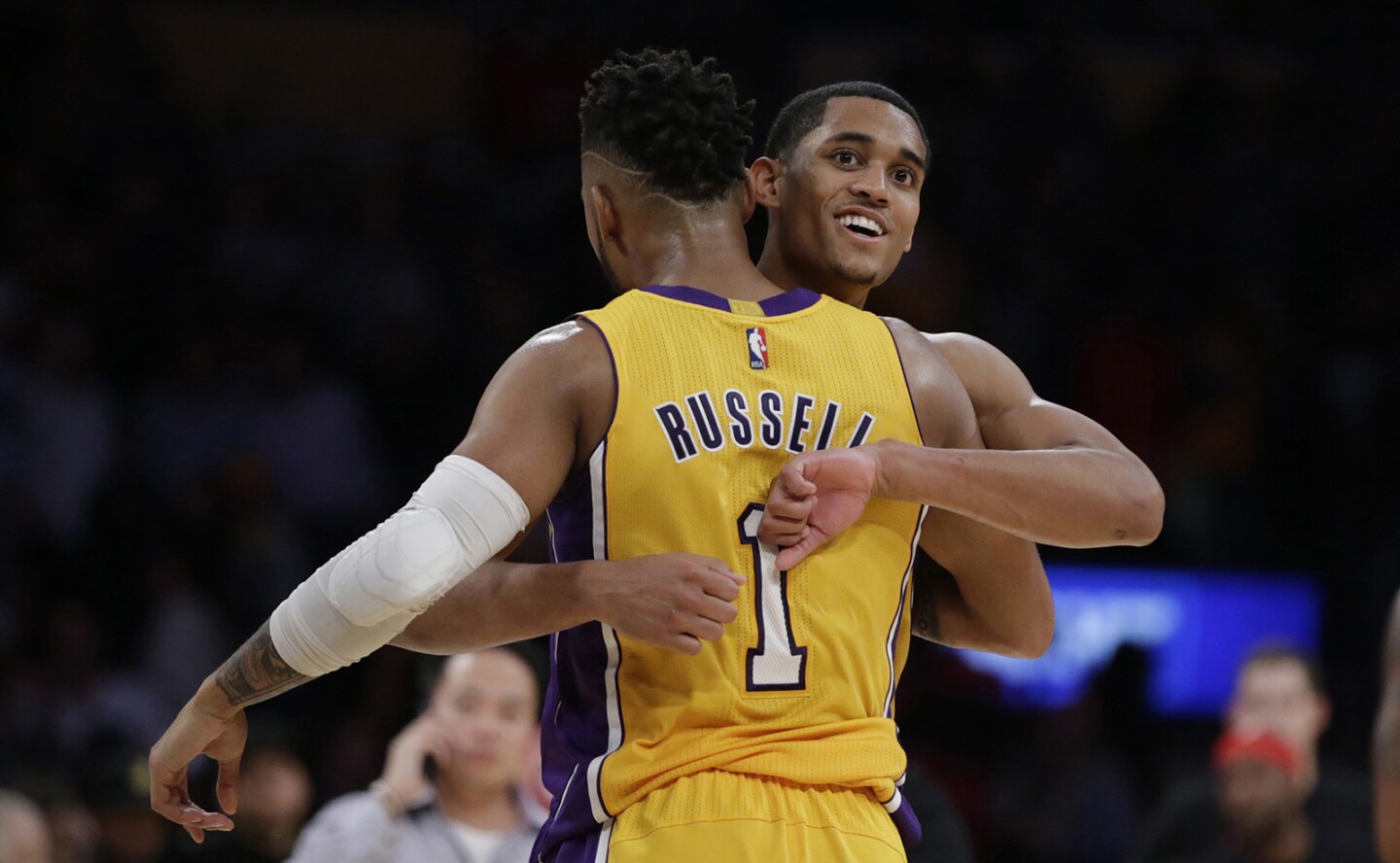 Lakers teammates Jordan Clarkson and D'Angelo Russell embrace after beating the Houston Rockets 120-114 at Staples Center.