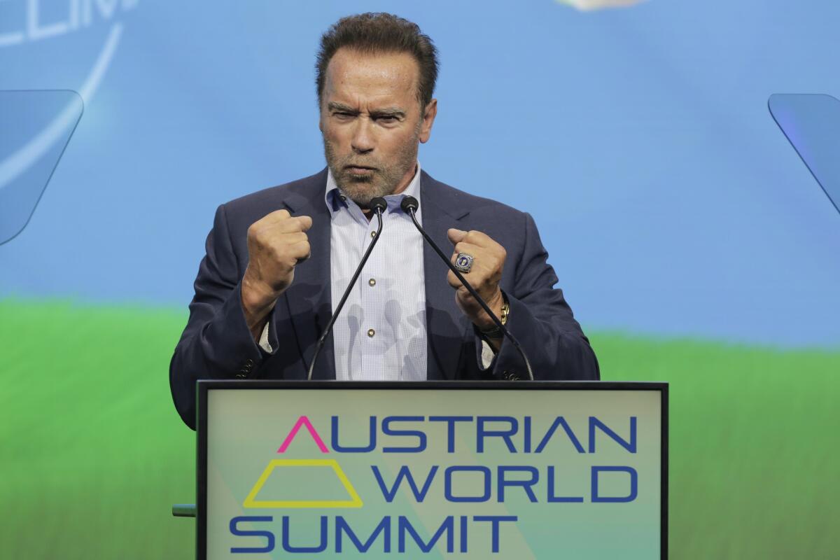 Arnold Schwarzenegger, Founder of the „Austrian World Summit" talks on stage about his dreams and actions to fight the climate crisis in Vienna, Austria, Thursday, July 1, 2021. (AP Photo/Lisa Leutner)