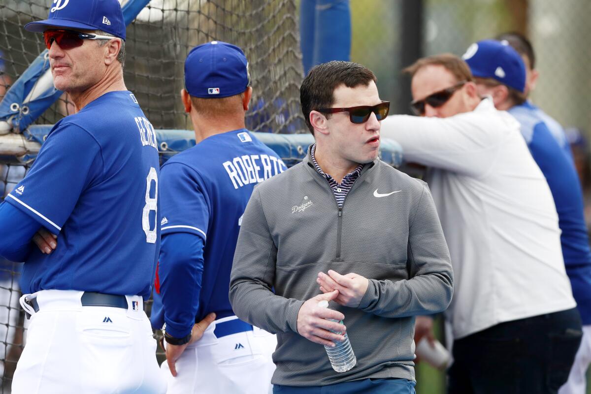 Los Angeles Dodgers President of Baseball Operations Andrew Friedman watches team drills.